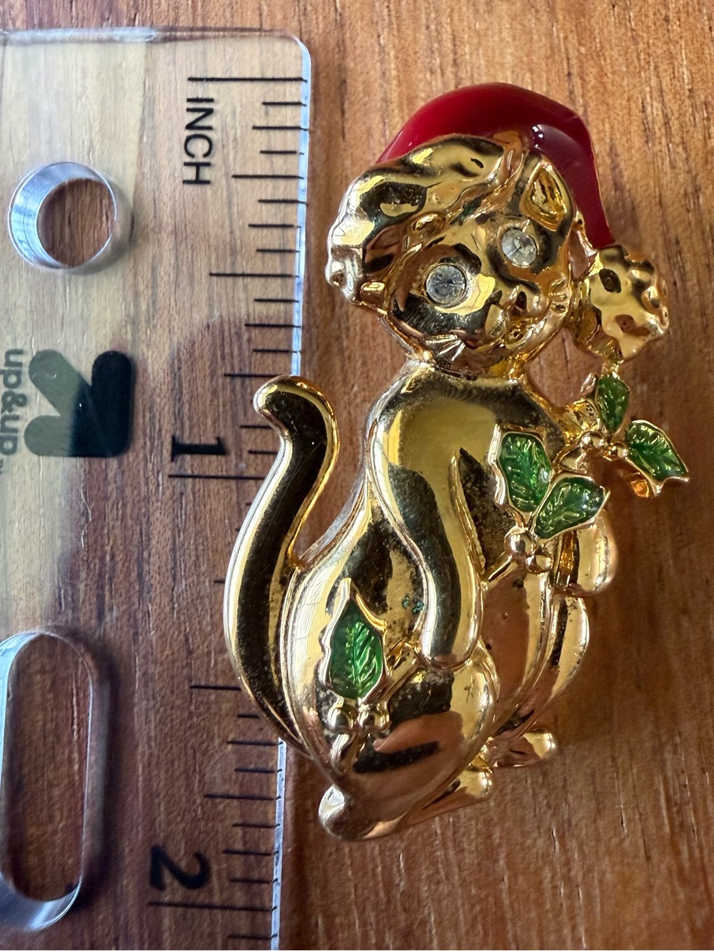 Vintage Gold Tone Christmas Cat Brooch with Red Hat and Green Leaf Accents Pin